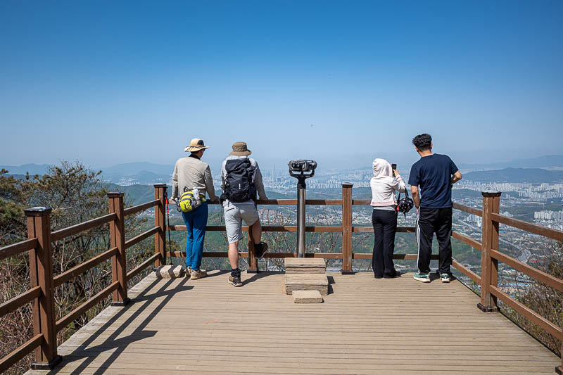 Korea-Seoul-Hiking-Geomdansan - People enjoying the view back towards Seoul.