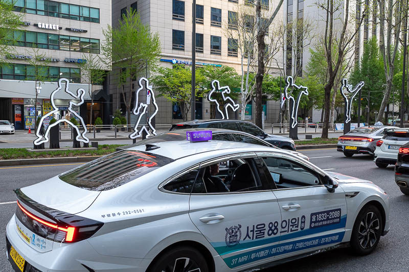 Korea-Seoul-Gangnam-Noodles - A taxi! No really behind me is the world Taekwondo headquarters, refer to previous trips for photos. Tonight it is relevant because I nearly died in a
