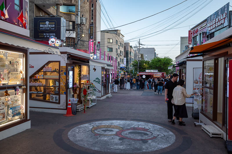 Korea-Seoul-Hongdae - As there is no room to walk along here, they have decided to plonk a few booths down in the middle of the walking area.