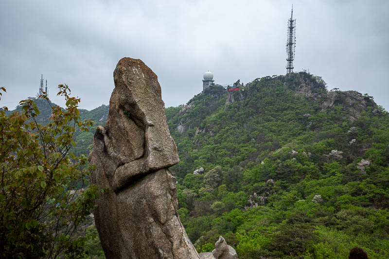 Korea-Seoul-Hiking-Gwanaksan - The golf ball tells me parts of the summit will be off limits. Also I can see a temple there - red bit to the right of the golf ball.