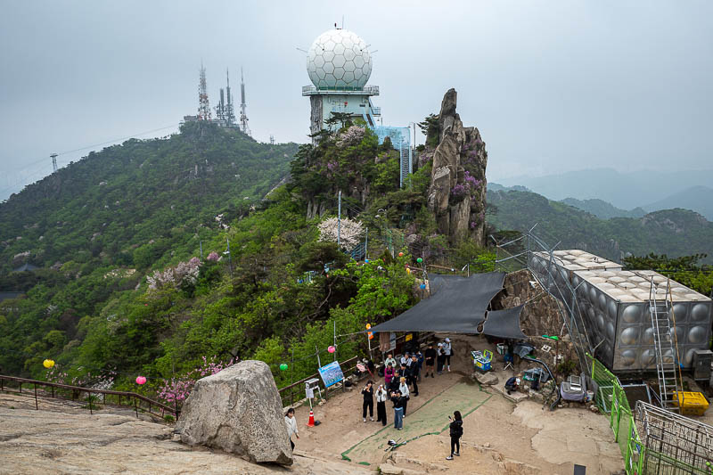 Korea-Seoul-Hiking-Gwanaksan - The summit area is very busy with a lot of construction. There is a cable car but I do not think it was operating today. You can see one of the cable 