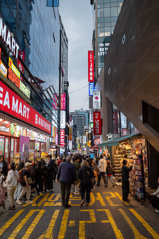 Korea-Seoul-Myeongdong-Bibimbap - But still quite busy. I like the yellow text on the road.