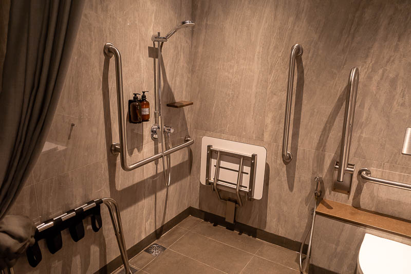 Korea-Singapore-Airport - Terrible. I got the disabled shower. It does not go high enough to stand under. The ENTIRE floor becomes wet, including the areas around the toilet, w