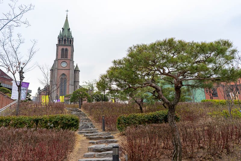 Korea - HK - China - KORKONG! - A nice tree getting photo bombed by a church. This is the main church, the map says so. There are mega churches all around the place but this one has 