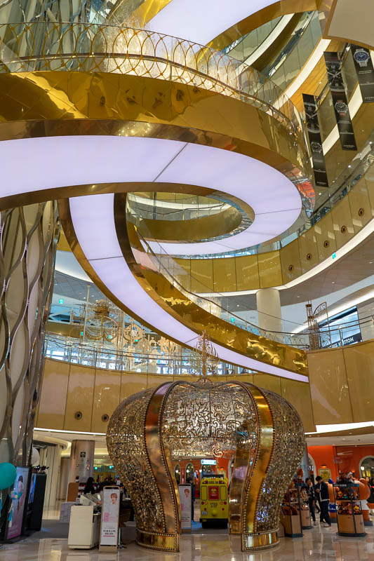 Korea - HK - China - KORKONG! - Inside the Lotte mall is a heap of faux gold and blocked off spiral staircases. It is a large modern mall with lots of good food.