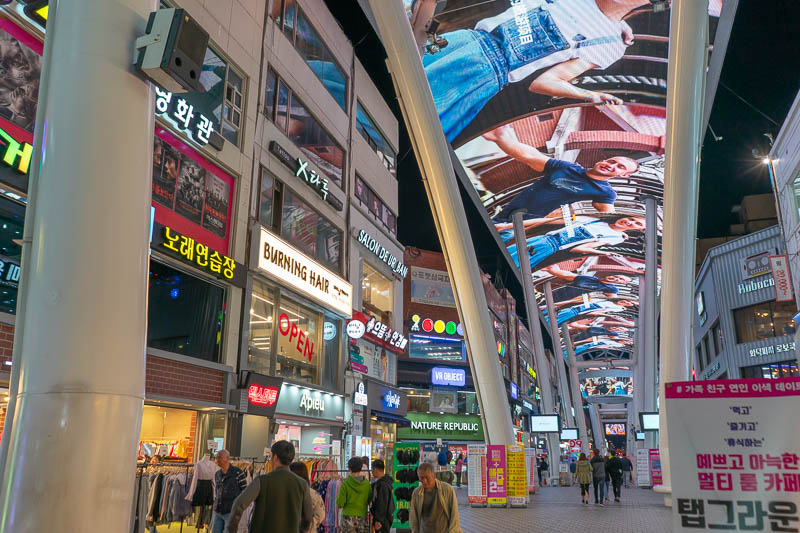 Korea-Daejeon-Shopping - I headed back under full motion video roof, currently playing advertisements.
