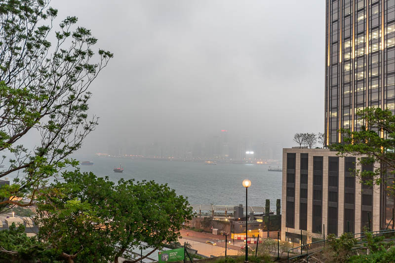 Korea - HK - China - KORKONG! - Here is the view, of rain. But concerningly, behind me there was a bunch of guys under the pagoda thing smoking dope. They looked like African war lor