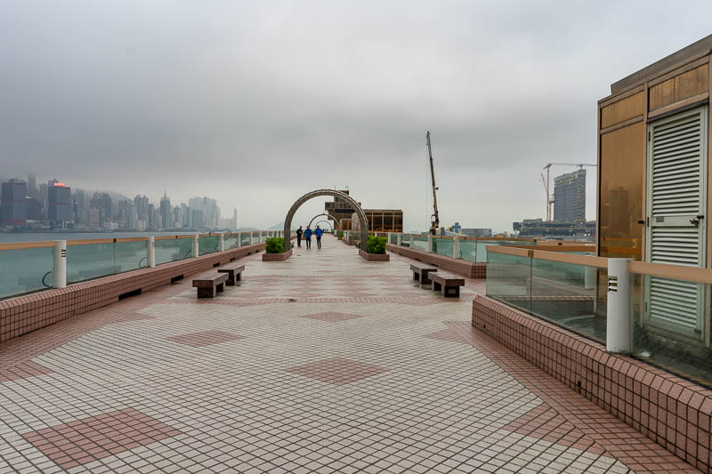 Hong Kong-Kowloon-Rain - If you climb up to the roof of the ferry terminal you can go out the back and get an amazing view of the harbour. It seems a very under populated loca