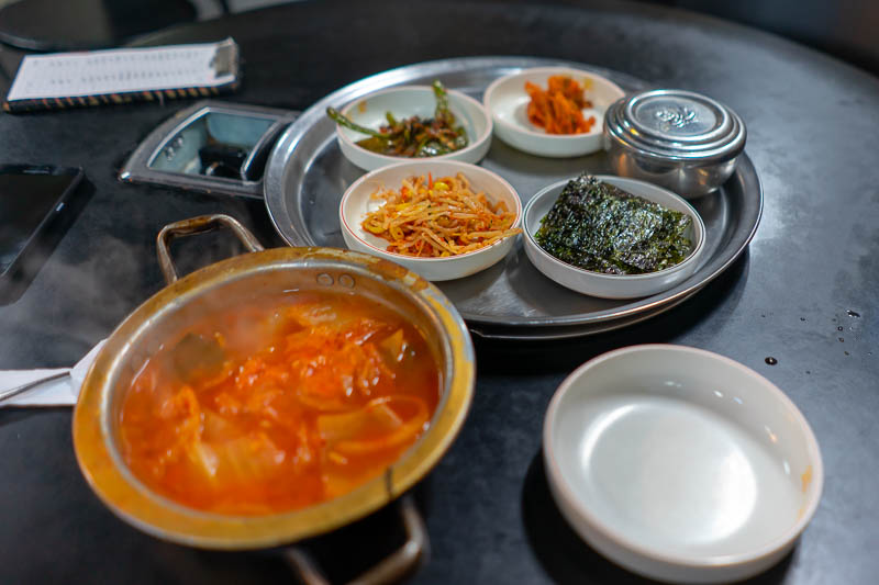 Korea - HK - China - KORKONG! - And here it is, poor person kimchi stew, with all the accompaniments. I chose a place that looked reasonably busy, striking the right balance between 