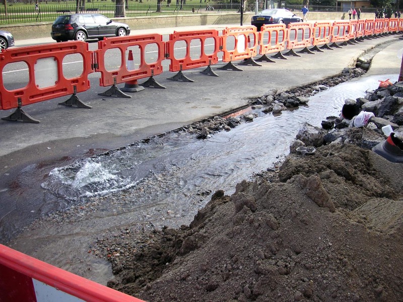 England-London-Kensington Park-Royal Albert Hall - Heres a busted water main, with lots of water coming out, it was doing the same thing when I was here 5 days ago, so I presume its been spewing water 