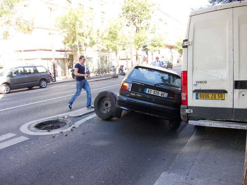 France-Paris-Arc de Triomphe-Eiffel Tower - Heres picture 1 of the car crash, he hit at full speed the concrete bollard thing you can see tipped over that separates the bus lane from the regular