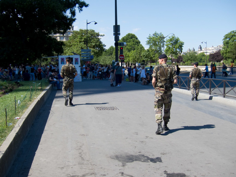 France-Paris-Arc de Triomphe-Eiffel Tower - Real soldiers with real loaded machine guns, note they are actually in patrol formation, people get out of their way, I follow and take photos. They a