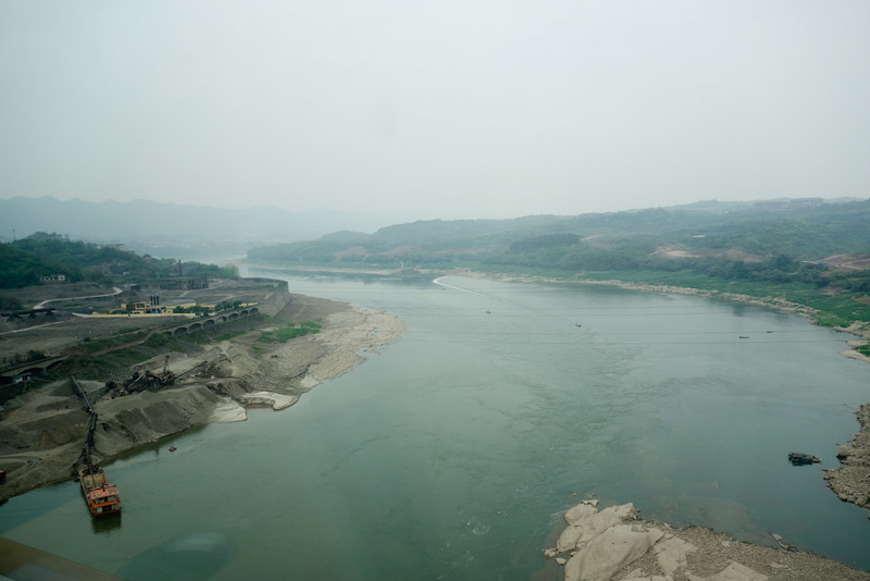 China-Chengdu-Chongqing-Bullet Train - And another big river, this one being mined for something.