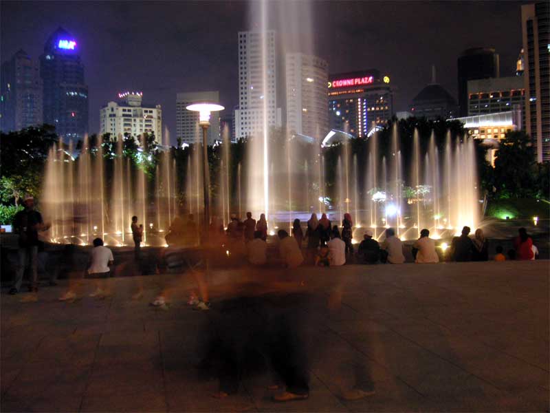 Malaysia-Kuala Lumpur-Petronas Towers - Different fountain, people walked through the shot giving the ghost effect.
