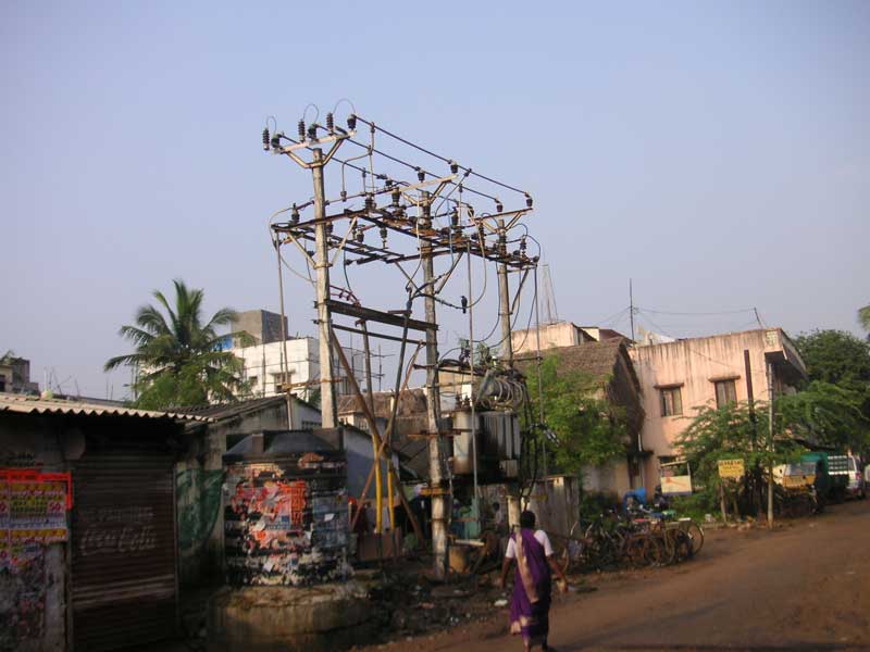 South East Asia December 2005 - Electricity is no problem, the local authority has erected 10,000 volt transformers on every street corner with no fence, this one buzzes loudly.