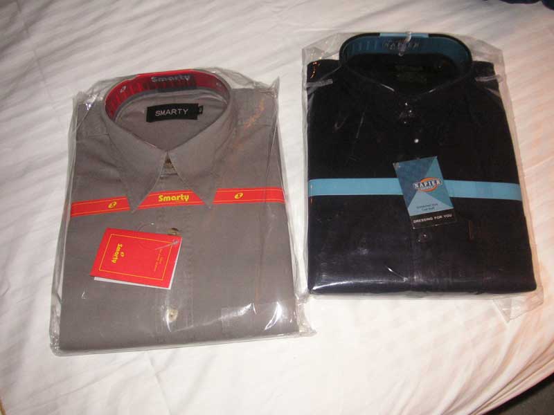 South East Asia December 2005 - My two brand name shirts, Smarty brand, and Napier brand - I have no idea if they are half way decent, but for $10 I can use them to wash the car.