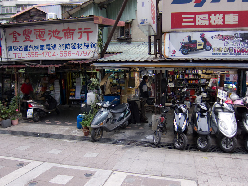 Taiwan / Hong Kong / Singapore - March/April 2011 - And heres a street full of scooter repair shops.