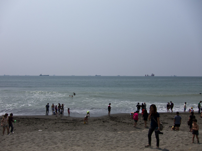 Taiwan-Kaohsiung-Cijin-Ferry - I was surprised to find an actual beach on the ocean side of the island. Its a black sand beach much like New Zealand. Notice all the ships out to sea