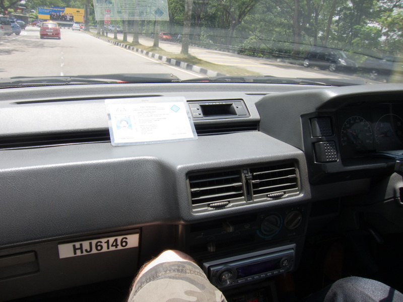 Taiwan / Hong Kong / Singapore - March/April 2011 - Riding in a taxi, the seat doesnt go back, my knees are around my ears, and the air conditioner is louder than a chainsaw.