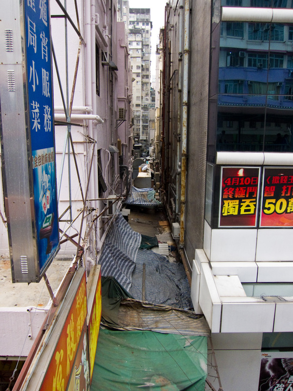 Taiwan / Hong Kong / Singapore - March/April 2011 - This is looking down on an alleyway. Under neath the sheets of plastic is a lot of fruit stalls etc. No spot in Hong Kong is left unoccupied, I think 