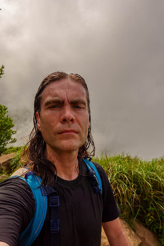 Taiwan-Taipei-Hiking-Datun-Yangmingshan - My completely soaked from head to toe head shot at the first peak.