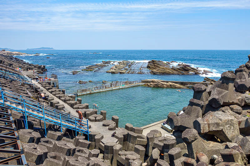 Taiwan for the 5th time - April and May 2023 - Despite this being a very industrial area, there is an open sea pool for old folks to strip off and strut about. A couple are swimming in it though, i