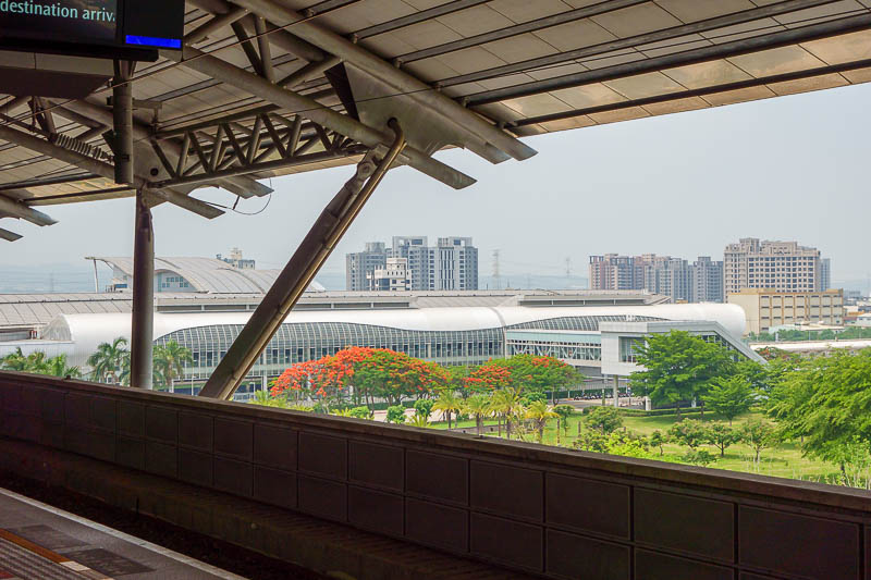 Taiwan for the 5th time - April and May 2023 - Here is the view from the Taichung high speed rail station. I already posted a similar one when I arrived. That big tree with all the red flowers is i