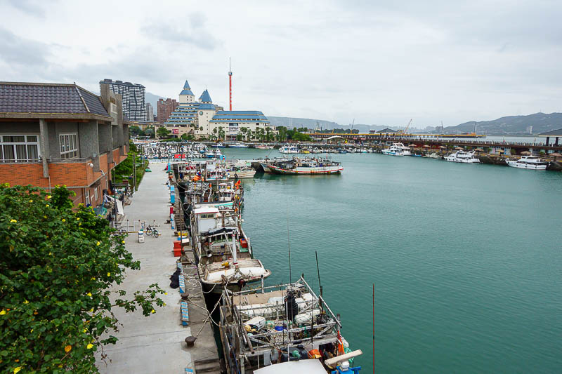 Taiwan for the 5th time - April and May 2023 - It is actually a working fisherman's wharf, but they seem to take Sunday off. That big red pole sticking up is a mechanical lookout thing that goes up